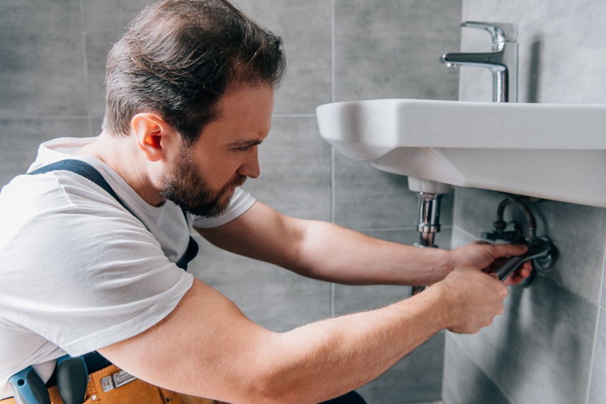 Plumbing Contractor Repairing a Sink in a Apex, NC Resident