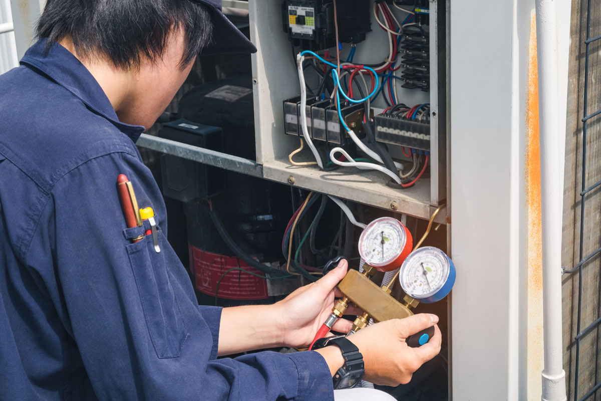 technician providing Air Conditioning Tune Up in Raleigh