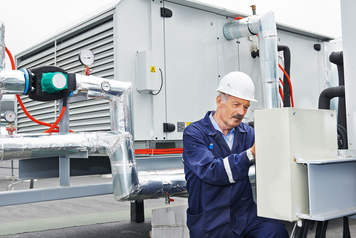 Technician Performing Maintenance on an Commercial HVAC System in Rolesville, NC