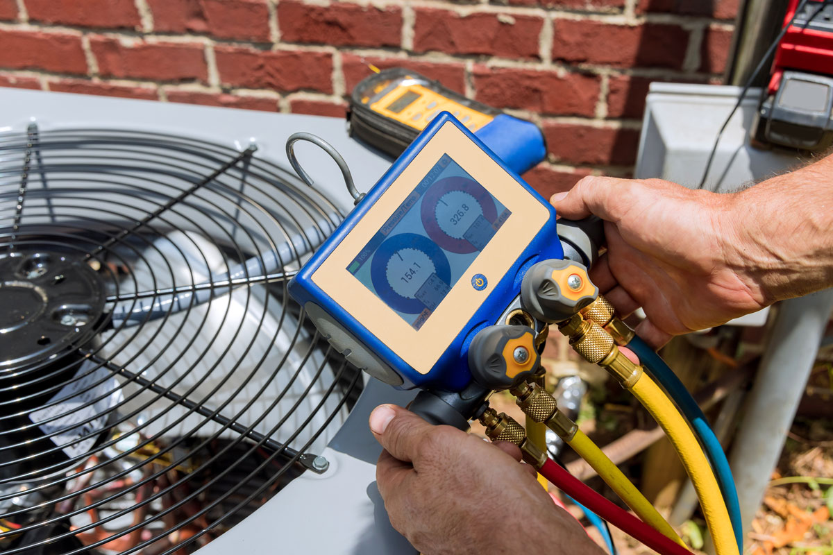 technician checking meter and providing Carrier HVAC Installation​