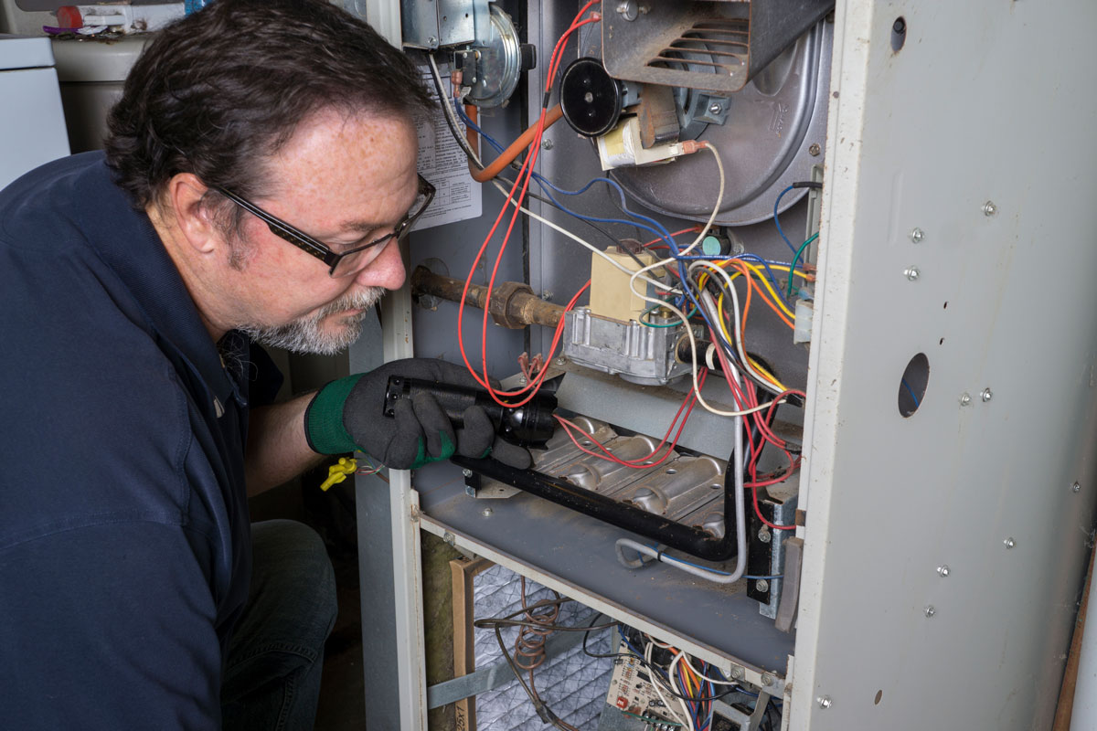 technician providing Carrier HVAC Service & Repair ​